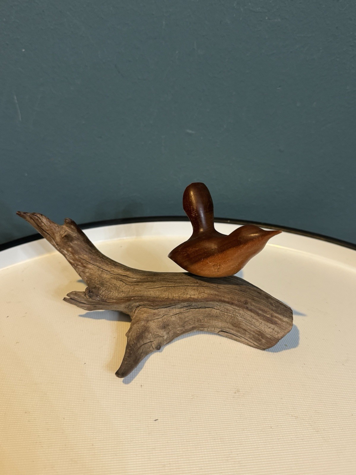 Sleek mid-century carved wood bird on branch