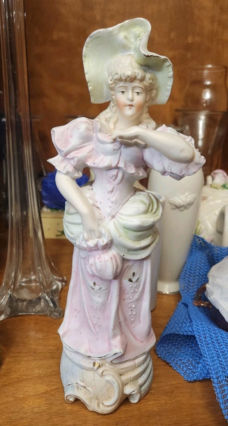 vintage bisque porcelain or ceramic figurine of a Victorian-style lady