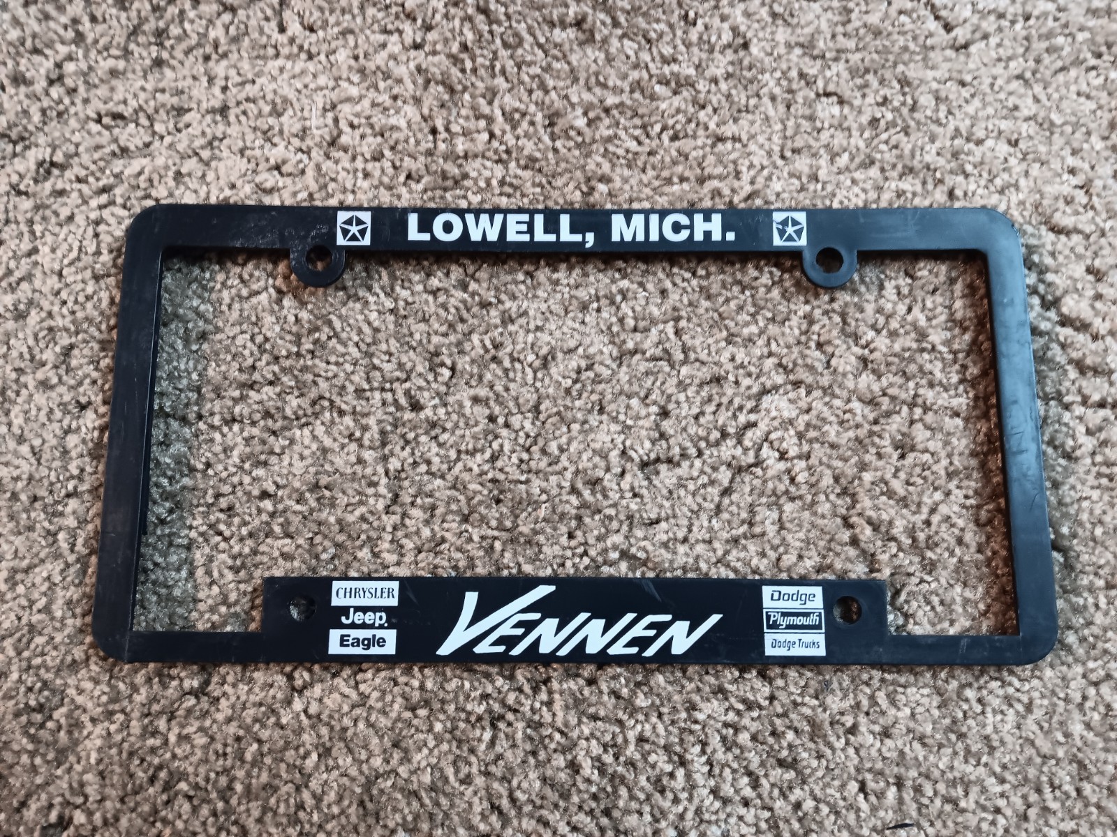 Vennen Chrysler Dodge Jeep, Lowell, MI Car Dealer Plastic License Plate Frame