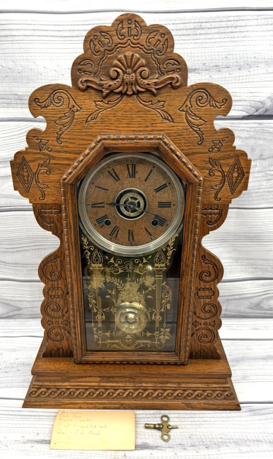 ANTIQUE OAK ANSONIA MANTLE CLOCK WITH ALARM AND FANCY PENDULUM - HAS KEY