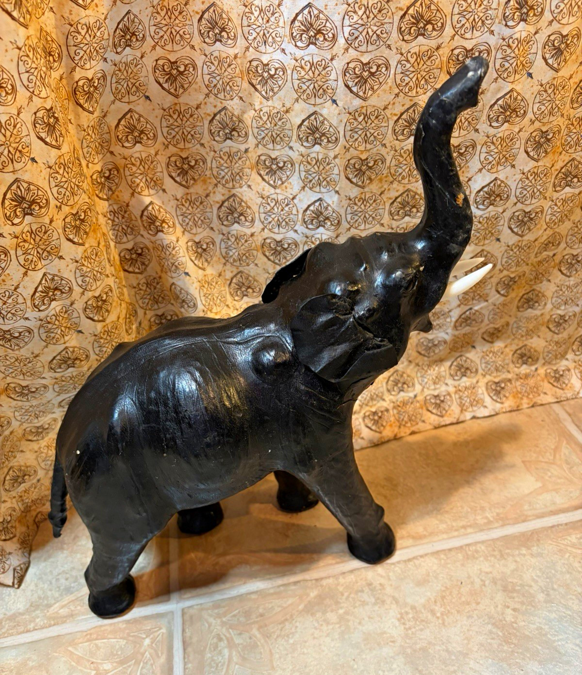 Vintage leather Black elephant figurine trunk up raised trunk with white tusks