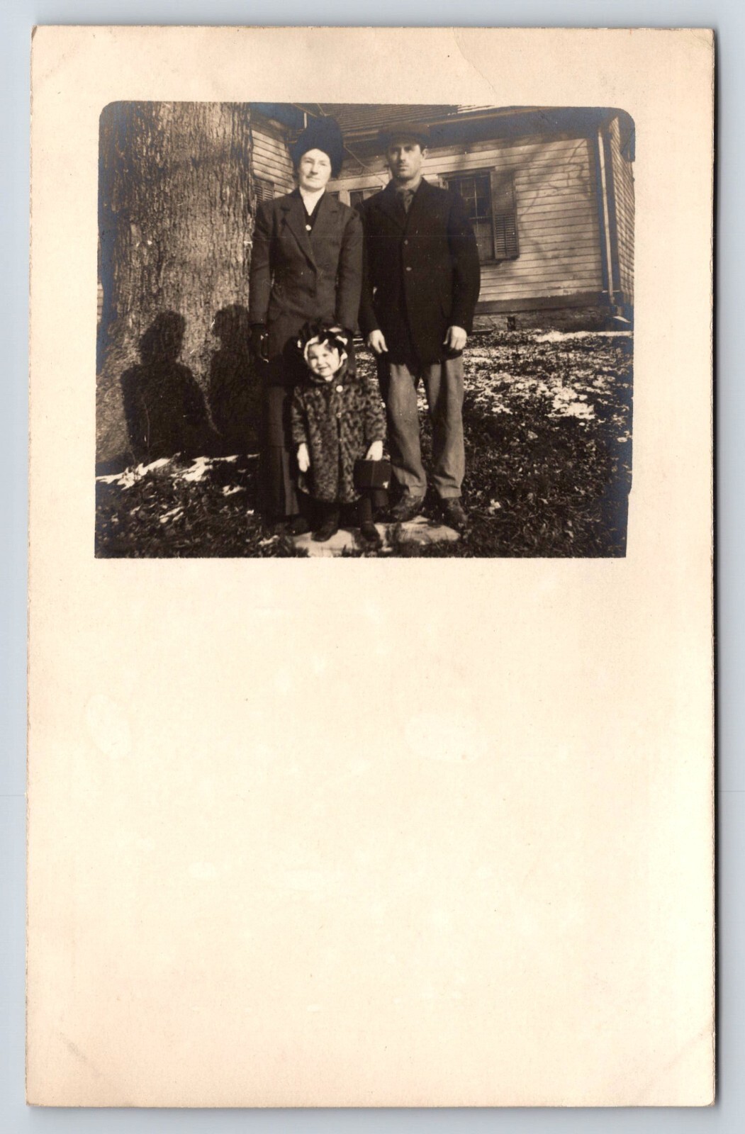 Postcard Unidentified RPPC Family Posing for Photo in Fromt of Home Winter Coats