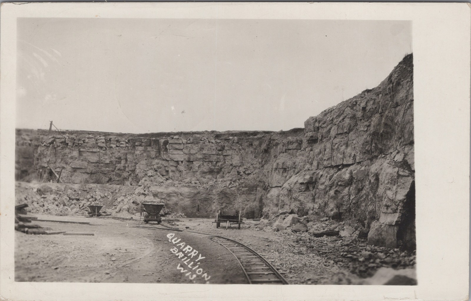 RPPC Brillion WI Quarry Rock Wall Tracks Ore Cars Wisconsin 1919 Postcard