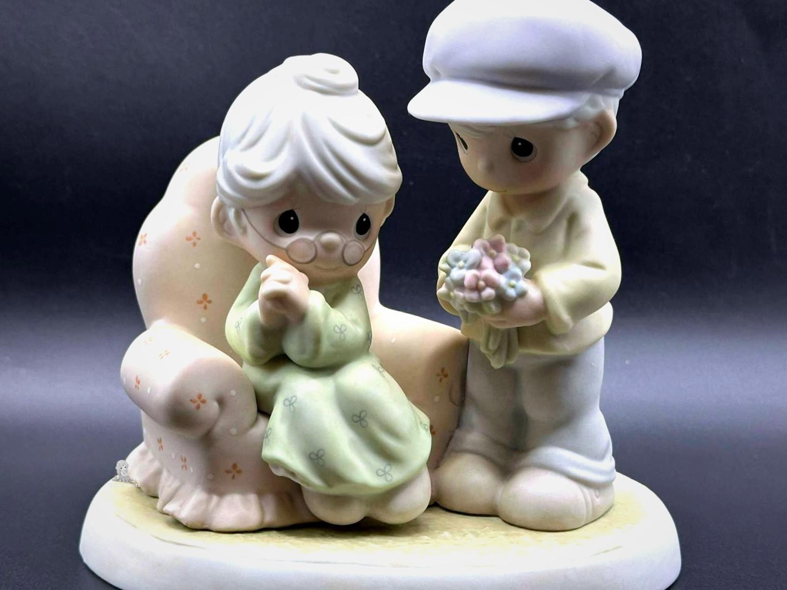 Precious Moments Figurine - Caring Man with Flowers.