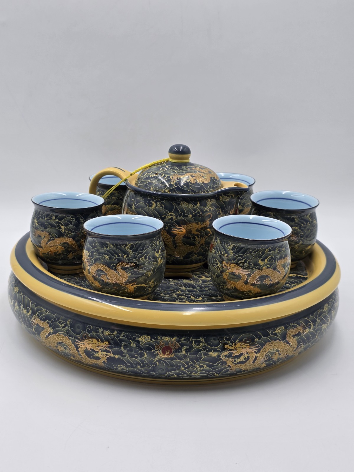 Chinese Qianlong Mark Porcelain Dragon Gongfu Tea Set Teapot 6 Cups Tray. New. Chinese Qianlong Mark Porcelain Dragon Gongfu Tea Set Teapot 6 Cups Tray. New.