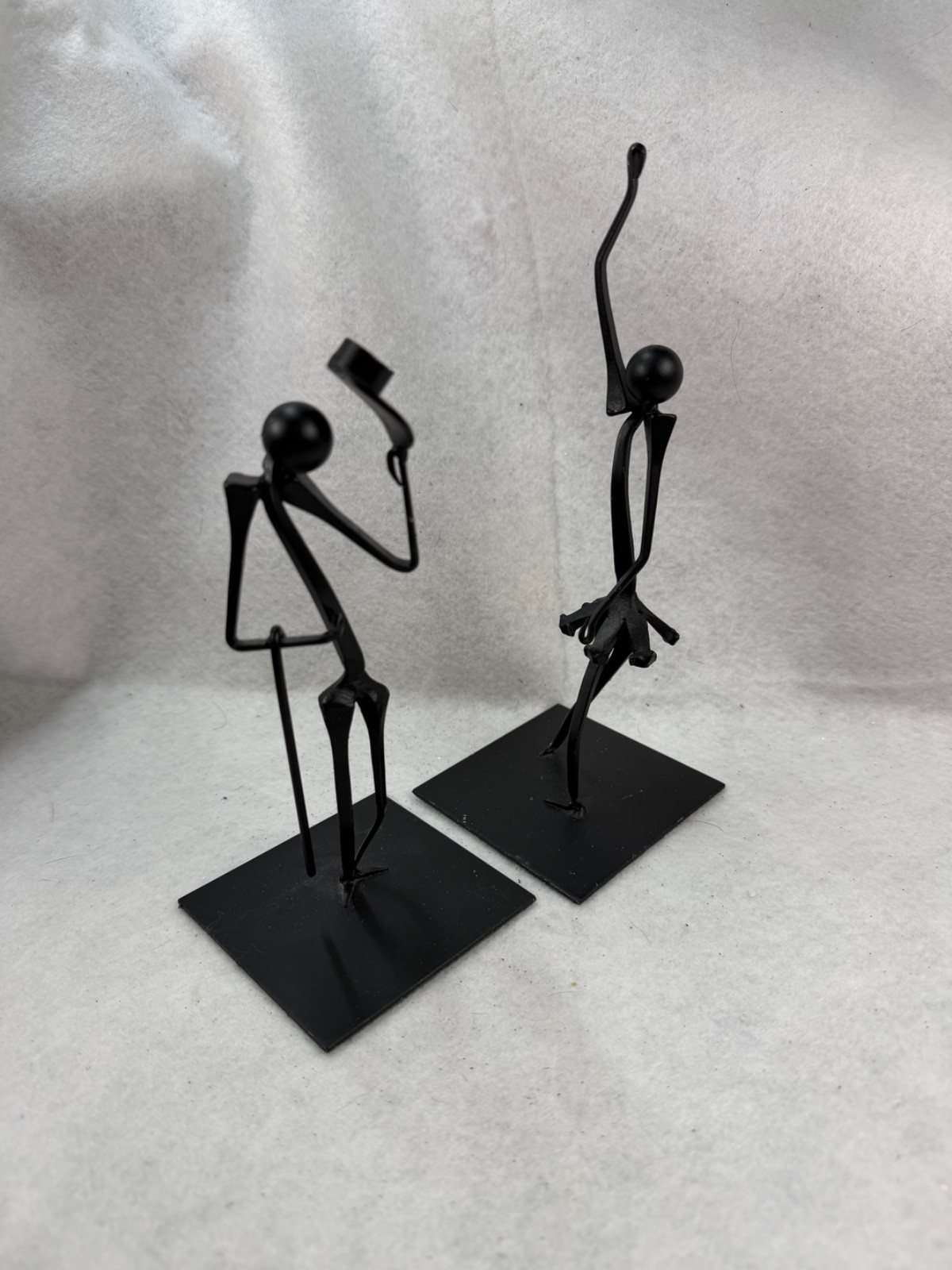 Two Black Metal Sculptures the Entertainer and the Ballerina