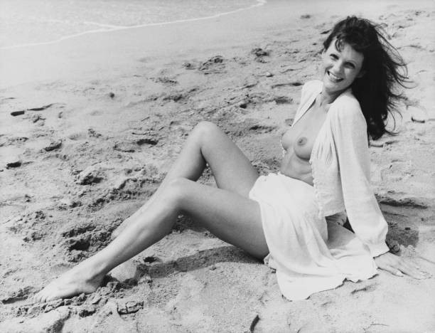 French actress Claudine Beccarie poses on beach during Cannes Film - Old Photo