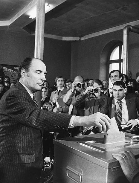 French politician Francois Mitterand putting his vote into a b- 1974 Old Photo