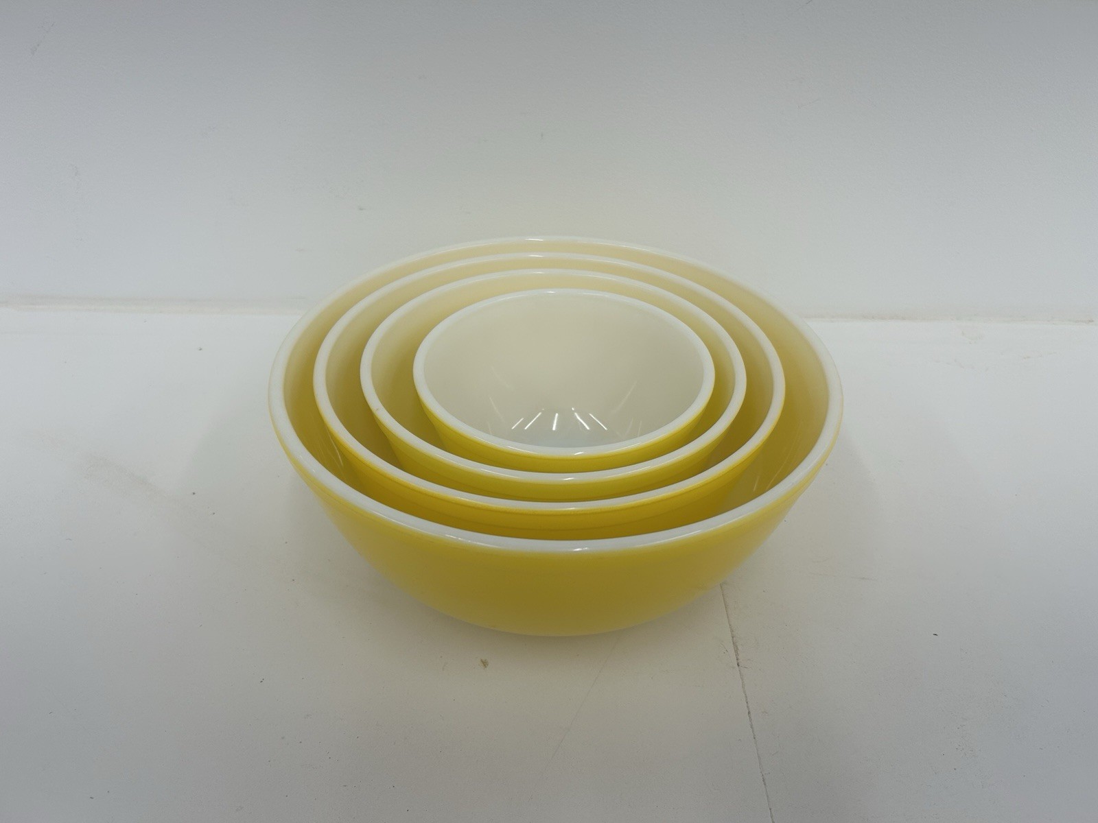 Set of four nesting bright yellow mixing bowls, #401,402,403,404