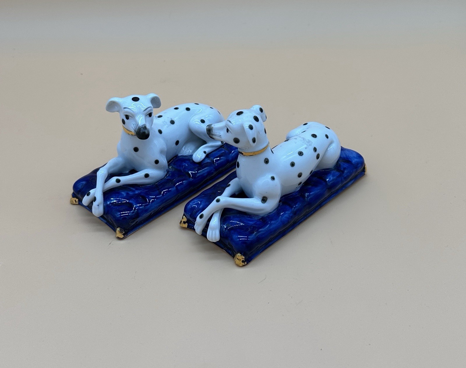 Vintage Staffordshire Style Porcelain Dalmatian Dog Figurines Pair Blue Cushions Vintage Staffordshire Style Porcelain Dalmatian Dog Figurines Pair Blue Cushions