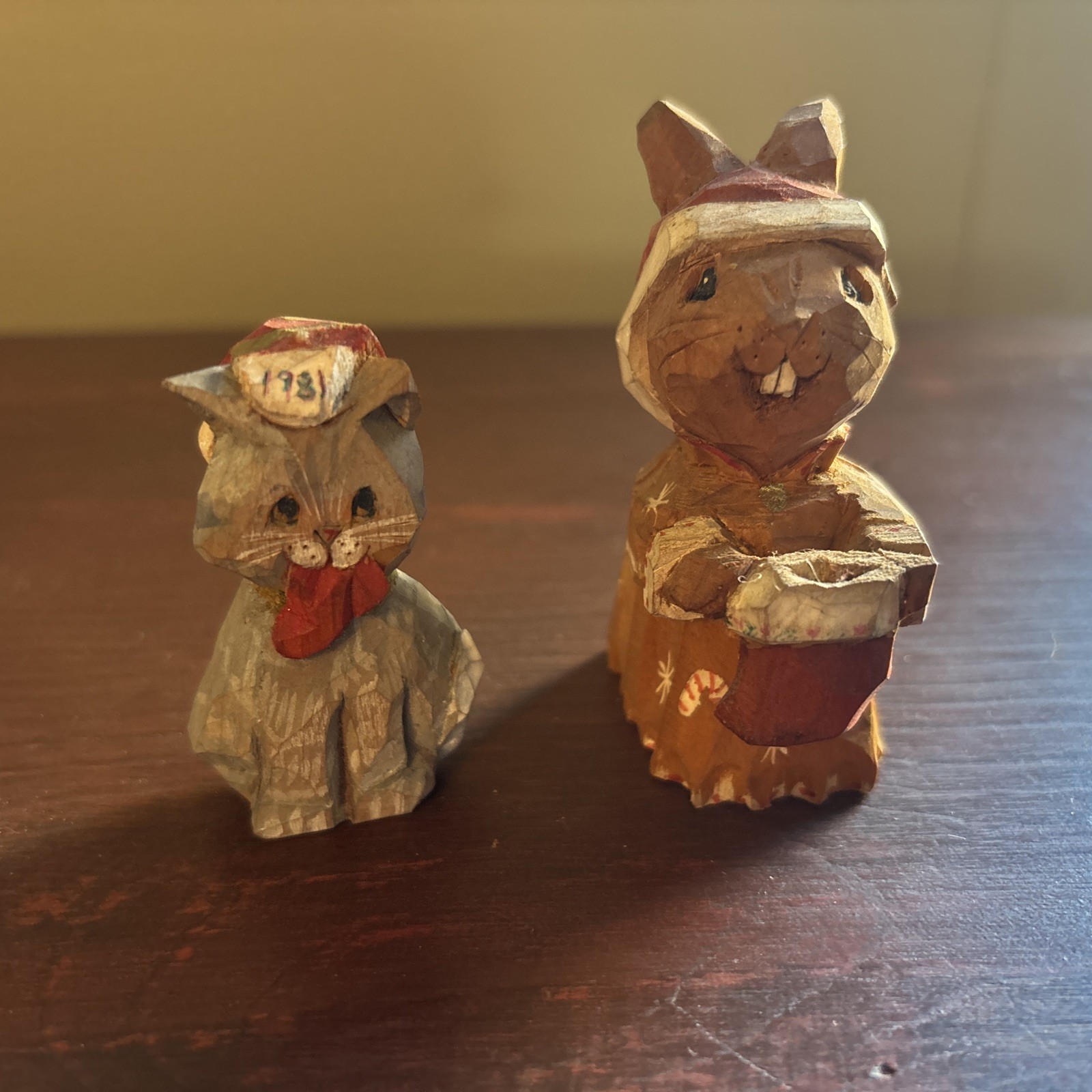 A pair of hand-whittled holiday animal figures by Laury Nichols A pair of hand-whittled holiday animal figures by Laury Nichols