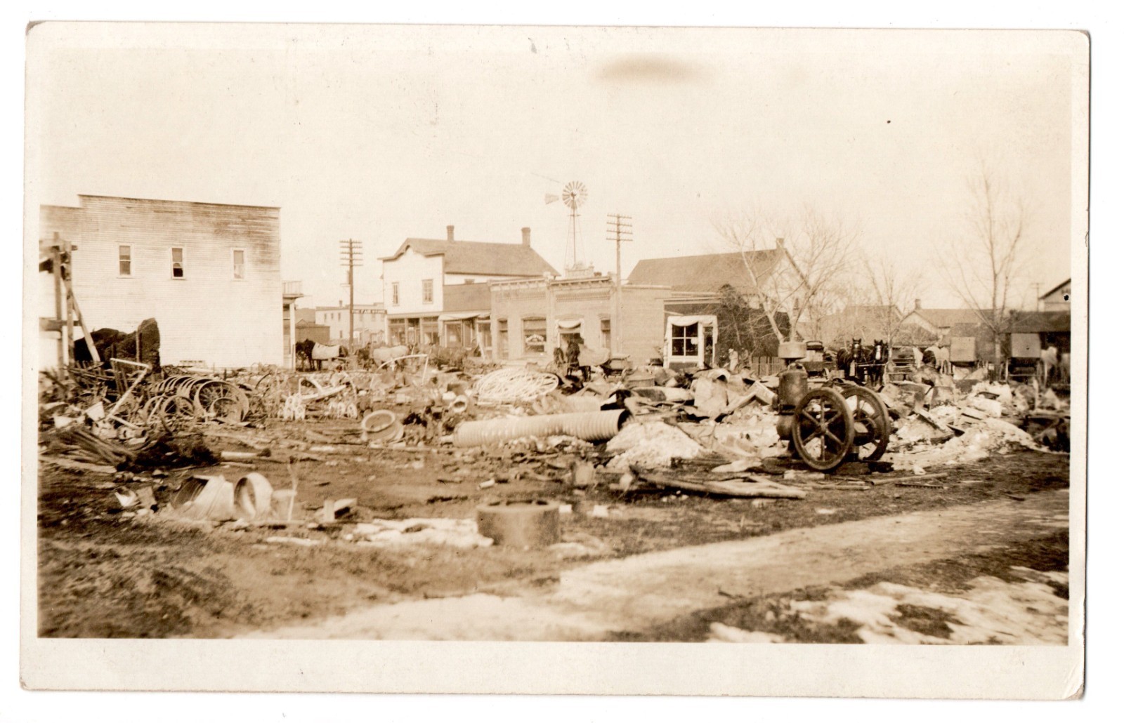 Vintage RPPC Postcard Scrap Yard Junk Shop Wagon Wheels Small Town Americana