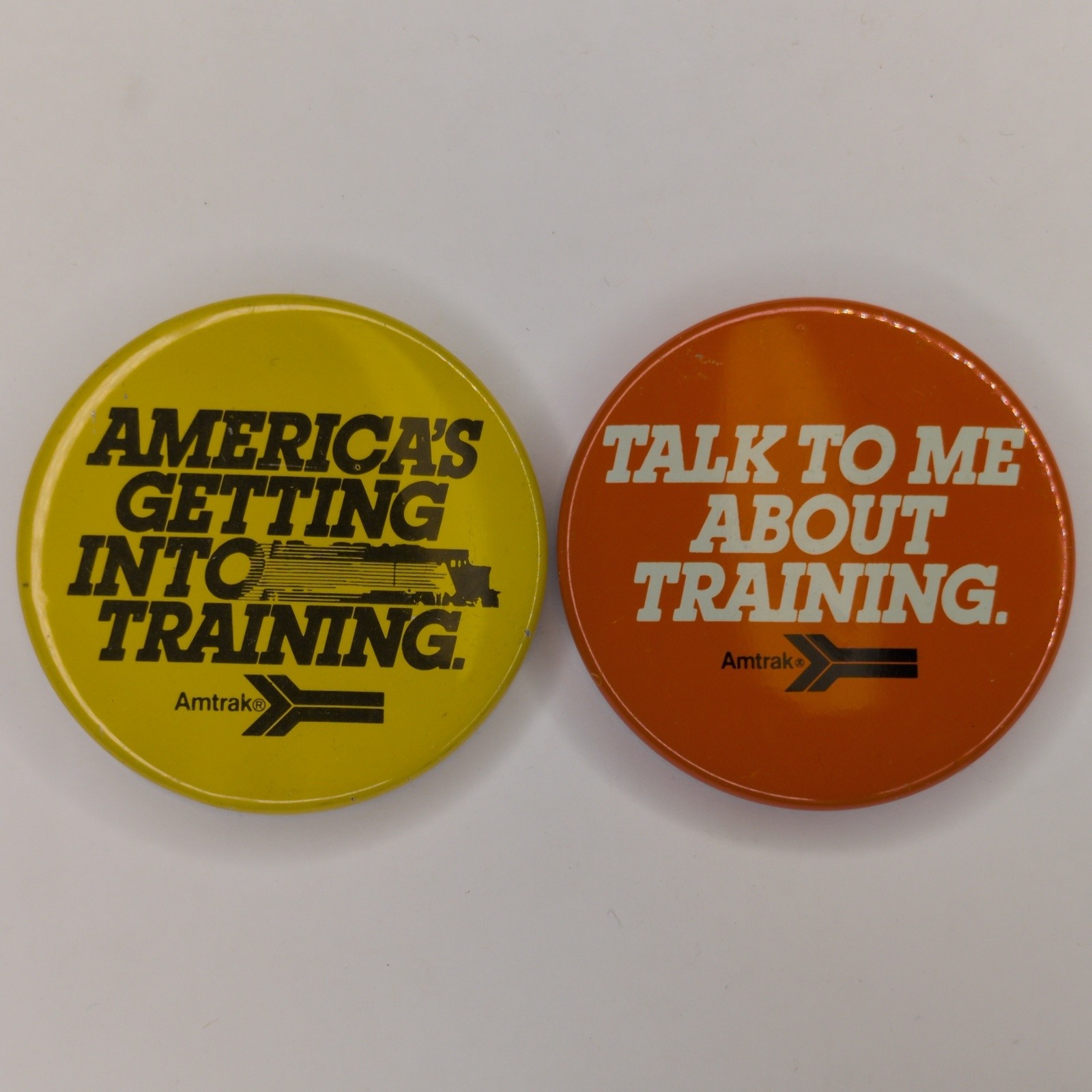 x2 LOT c1970s Amtrak Railroad Train Advertising Pinback Buttons Training E9