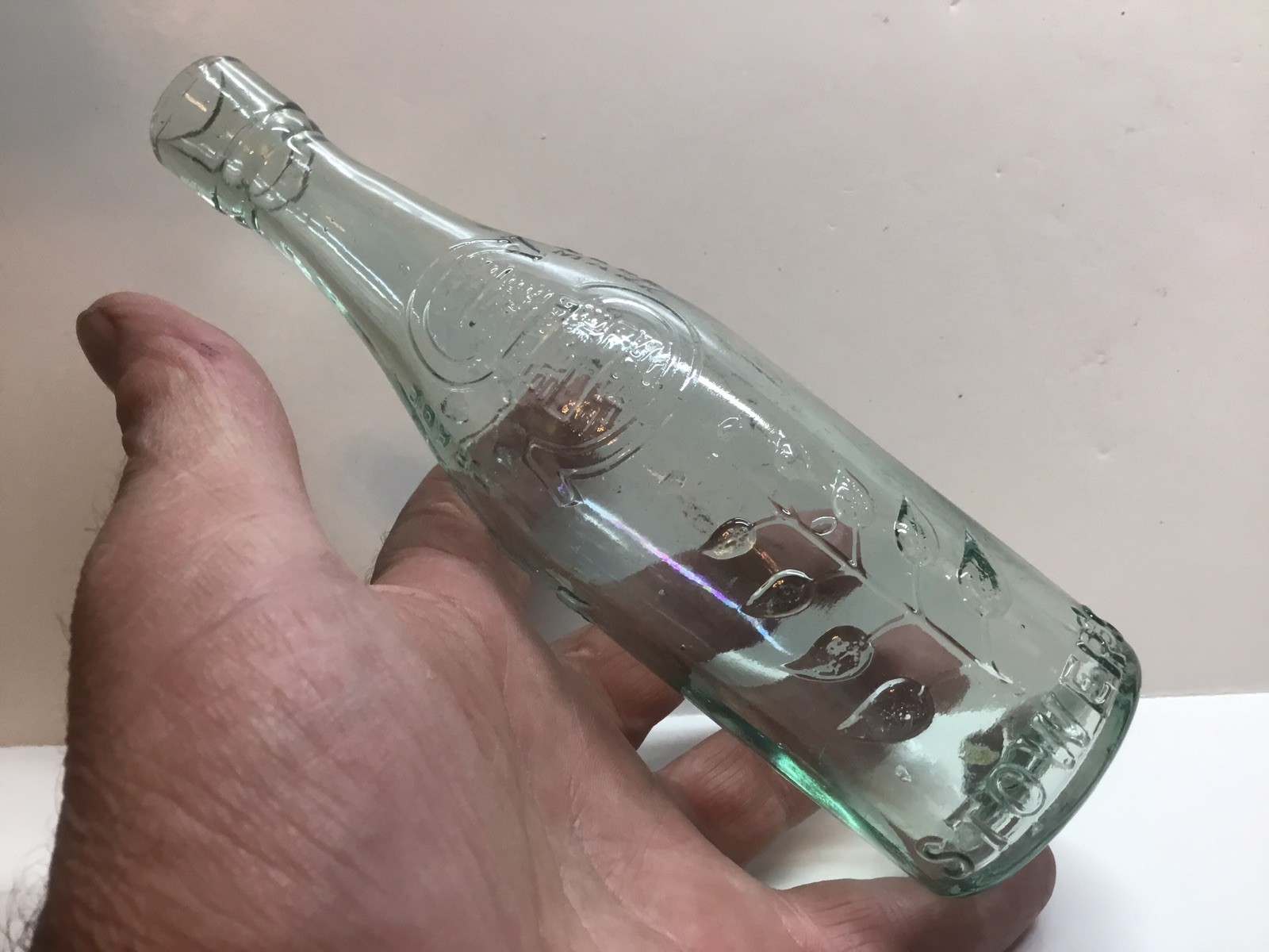 Small Antique Stower’s Lime Juice Bottle.