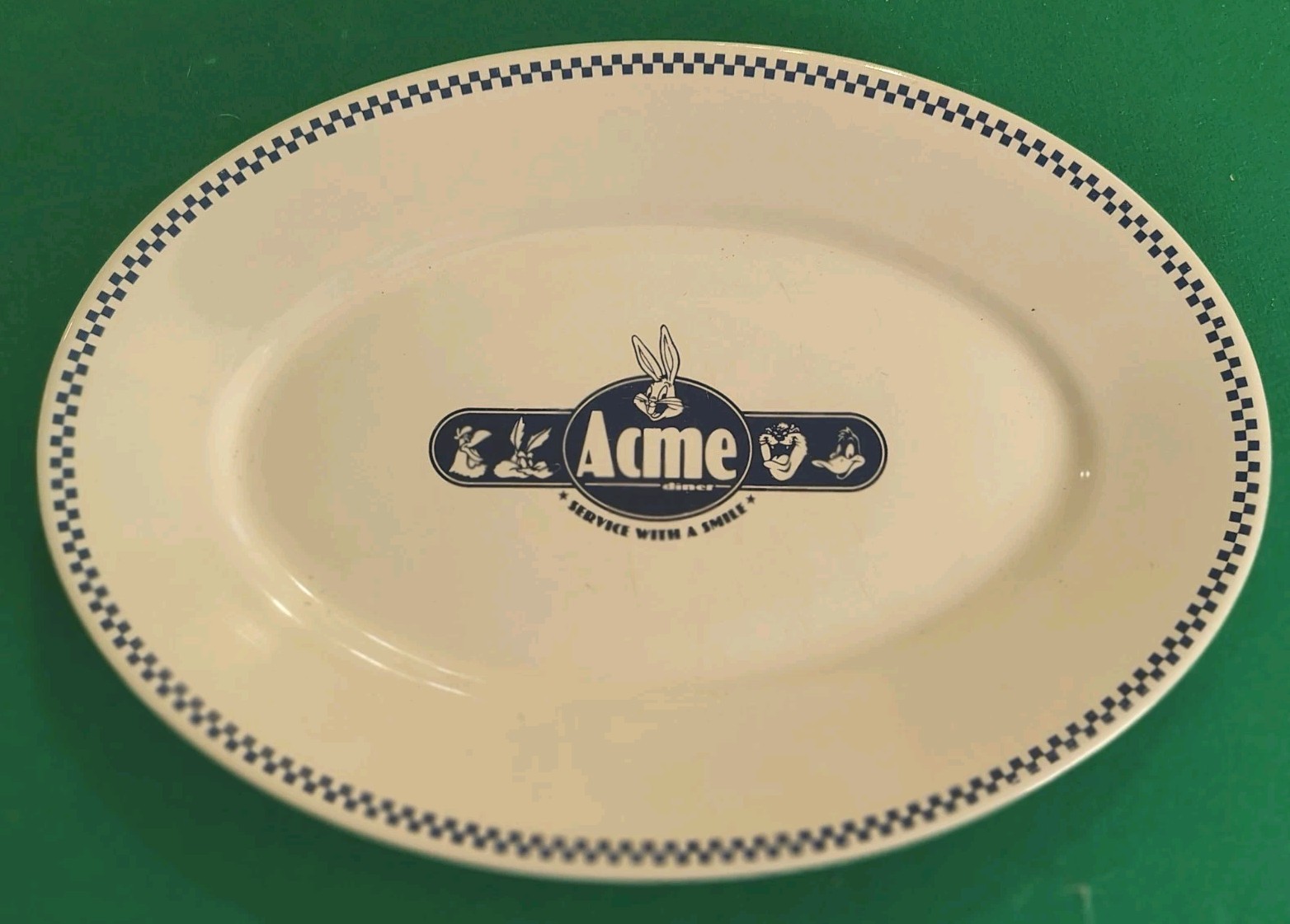 ACME Service With A Smile Oval Plate Homeworks 1993
