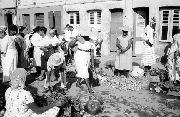 women buying fruits vegetables an outdoor market Martinique 1950s Old Photo