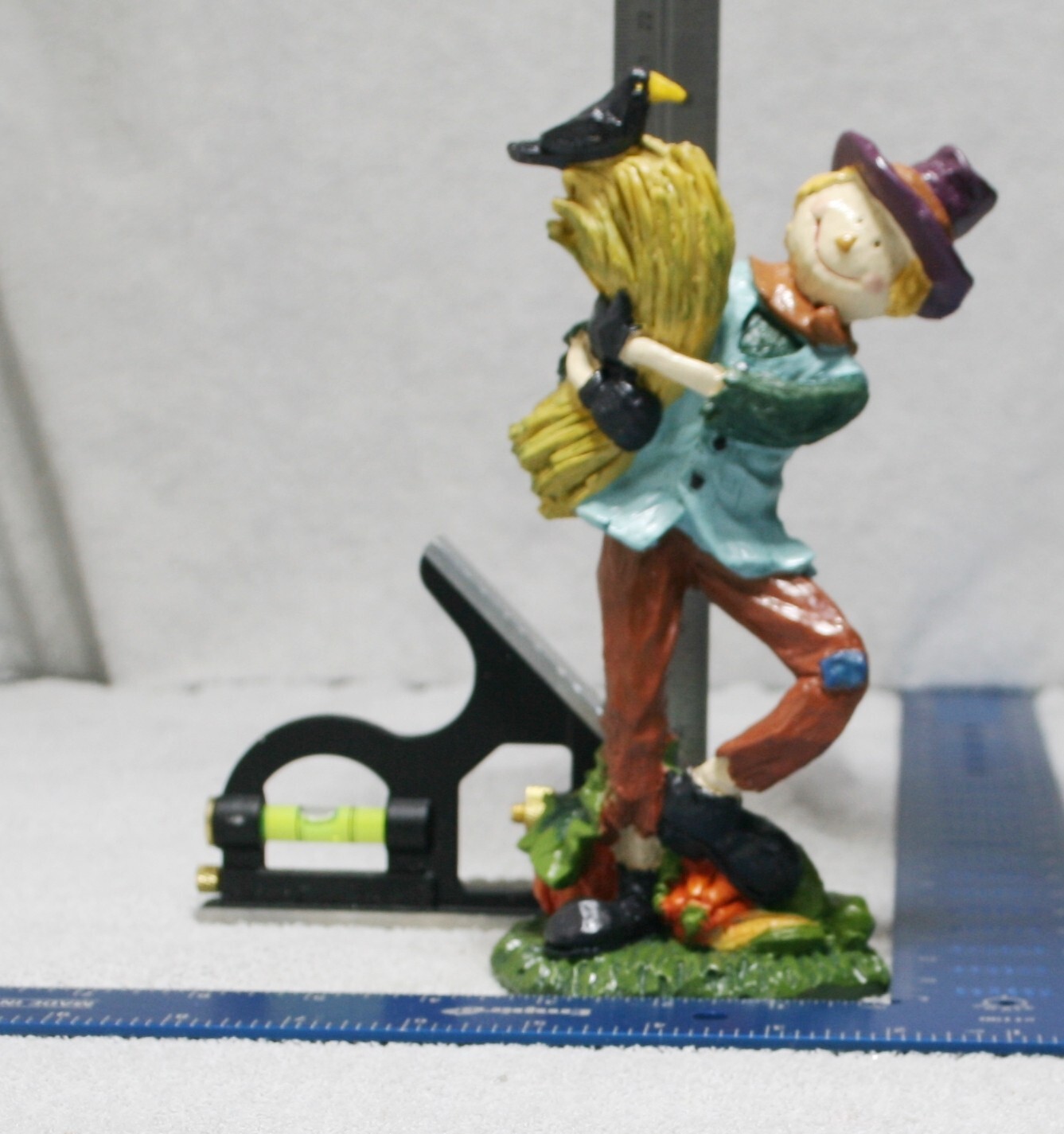 Autumn Fall Deco Scarecrow holding Bundle of Hay Figurine with crow Hat Resin