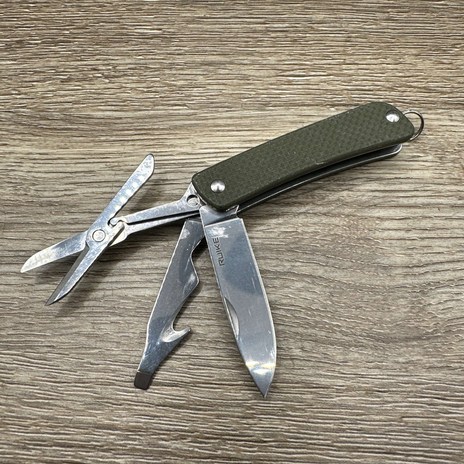 Ruike Multitool S31-G Sandvik 12C27 Steel Used Green Pocket Knife