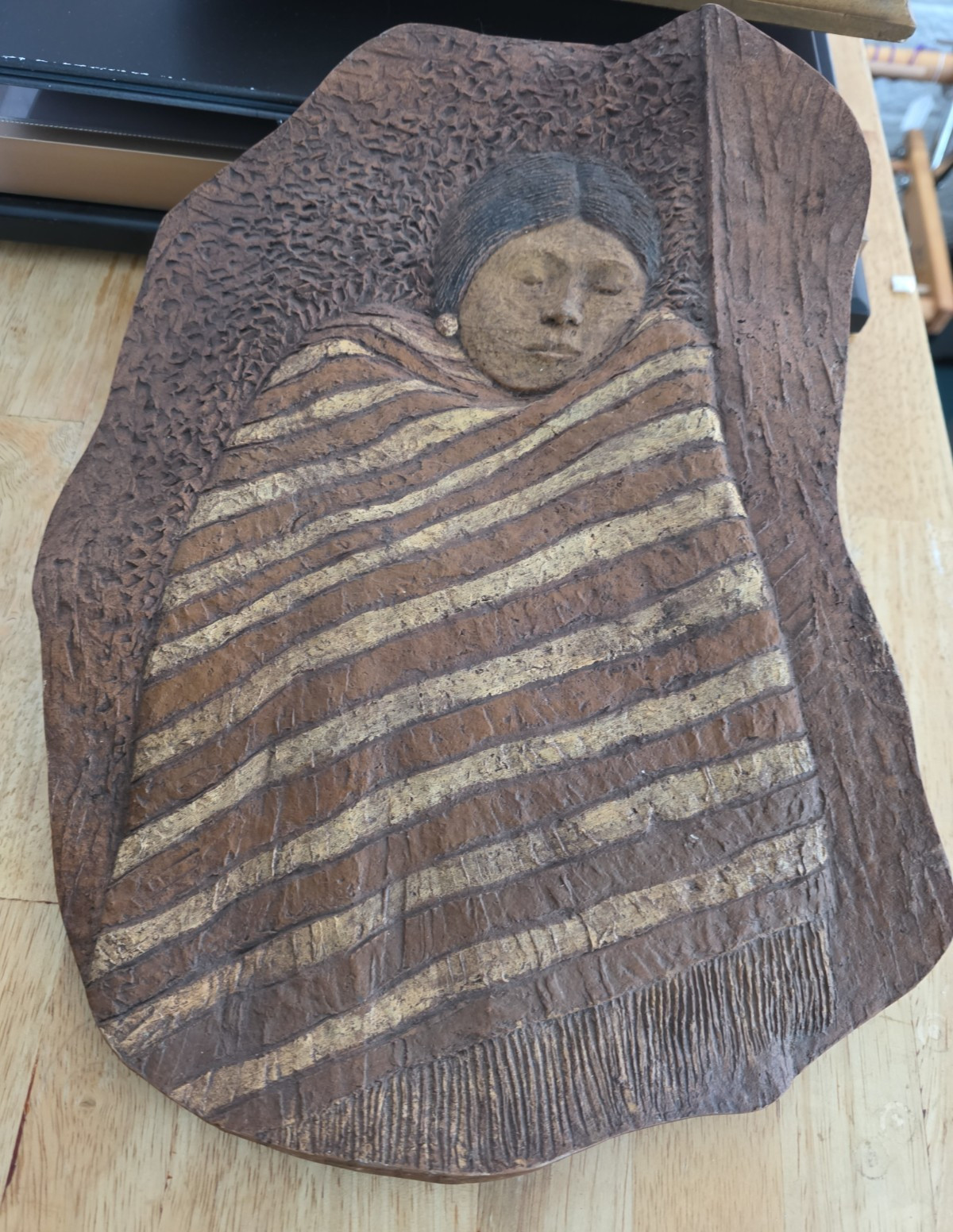 First Nation Sleeping Girl Face Drawing on Red Clay
