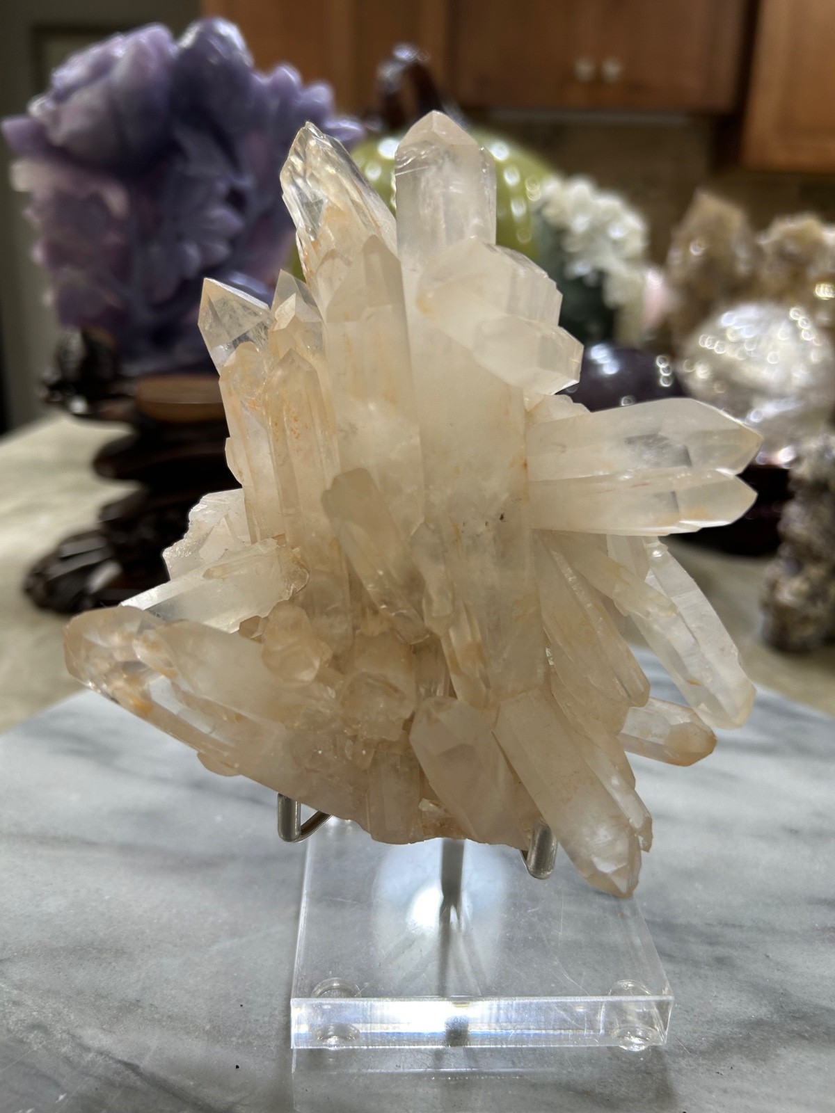 quartz crystal cluster on acrylic stand