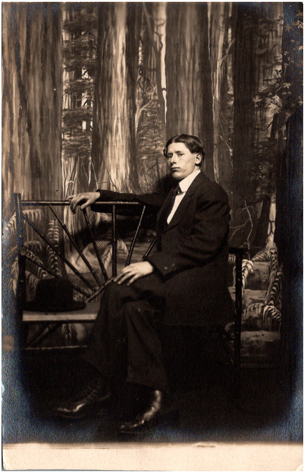 Serious Dapper Man Sitting on Bench in Suit Studio Photo 1900s RPPC Postcard