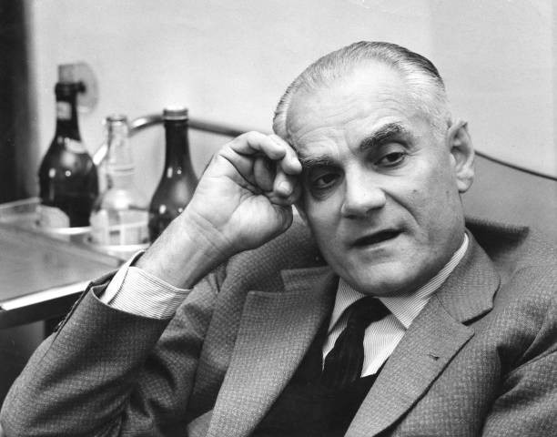 Italian writer Alberto Moravia talking sitting down 1960 Old Photo