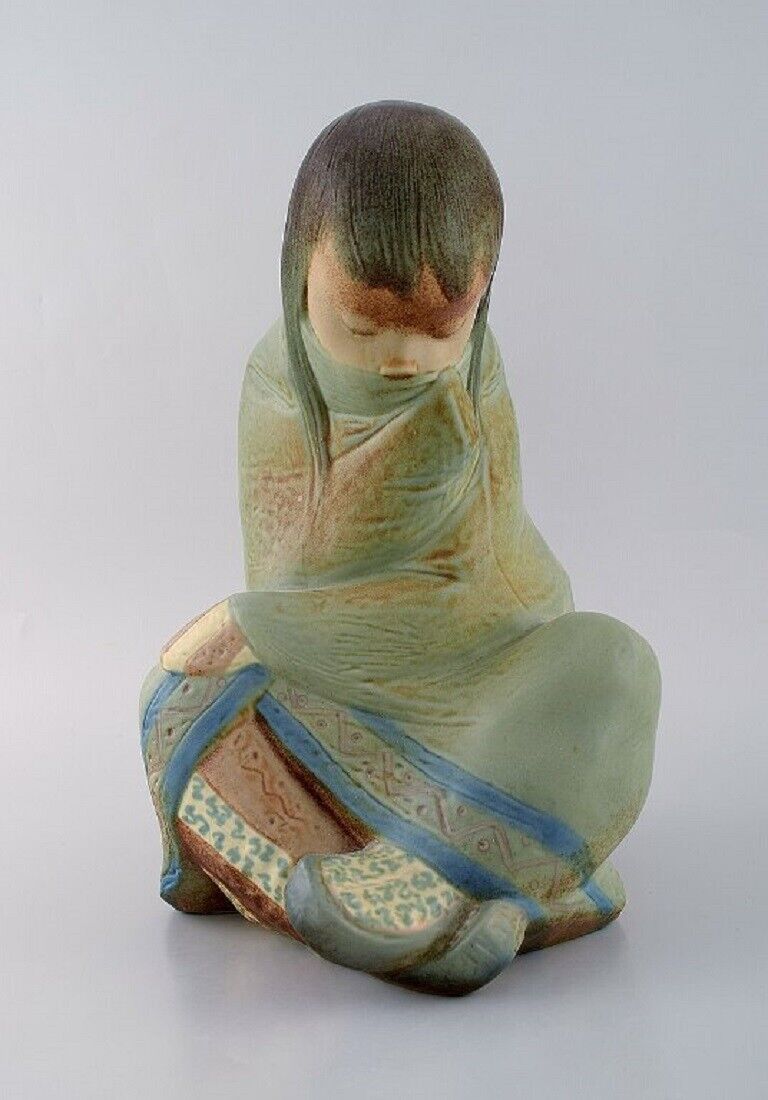 Lladro, Spain. Large sculpture in glazed ceramics. Sitting girl. 1980s