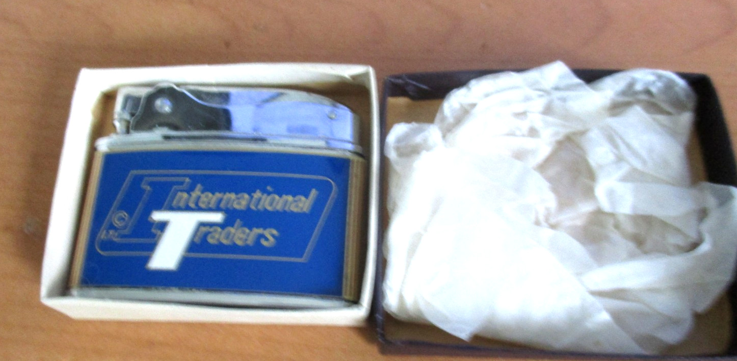 VINTAGE NOBLE INTERNATIONAL TRADERS ADVERTISING FLAT LIGHTER W/BOX -JAPAN -EXCEL