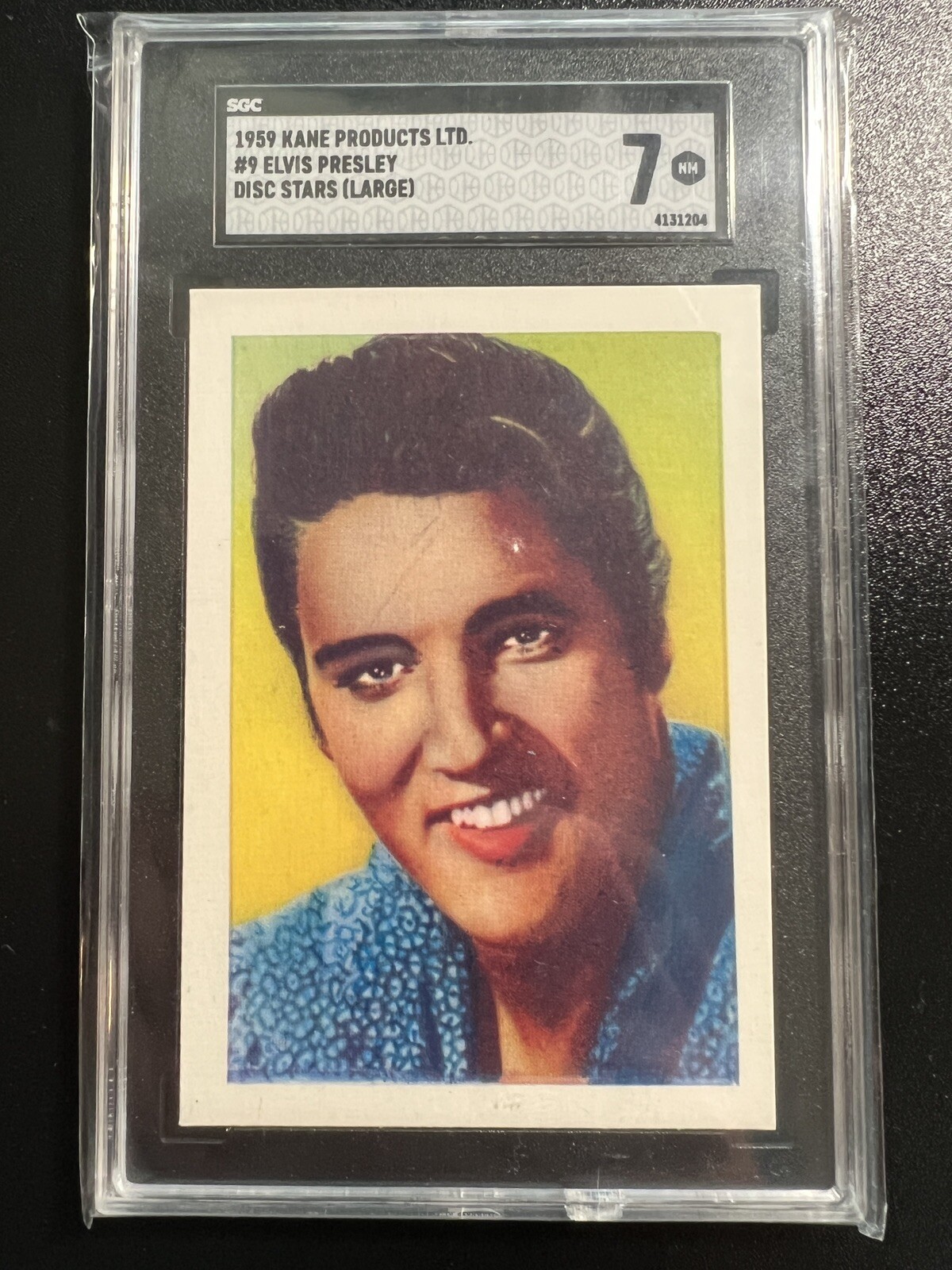 NEAR MINT  ELVIS PRESLEY in 1959 Kane Disc Card. PSA Certified.