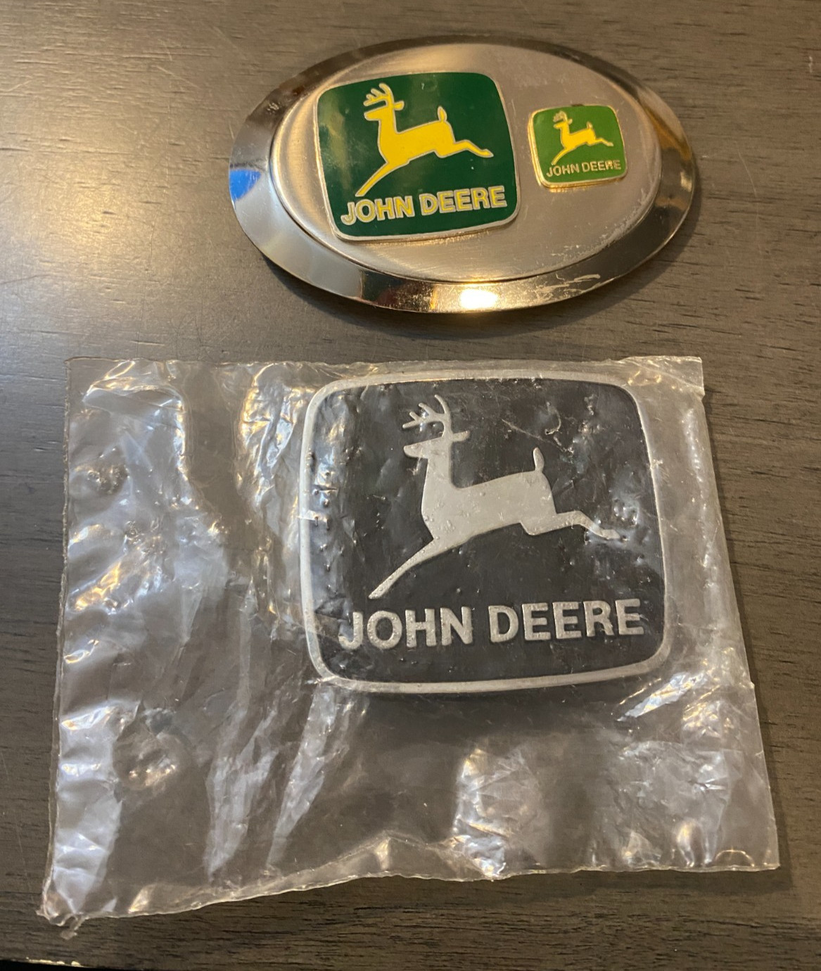 Vintage John Deere Belt Buckle Lot of 2 USA, 1-NOS Factory Sealed, 1-Oval AS IS Vintage John Deere Belt Buckle Lot of 2 USA, 1-NOS Factory Sealed, 1-Oval AS IS