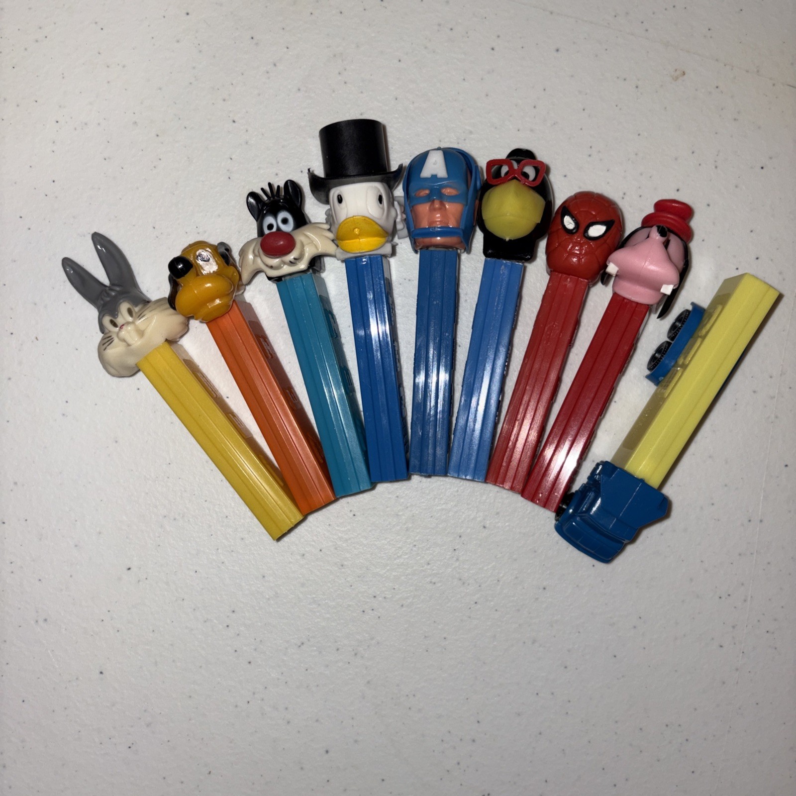 Pez vintage no feet lot of 9 including Truck, Captain America, Raven, Spider Man