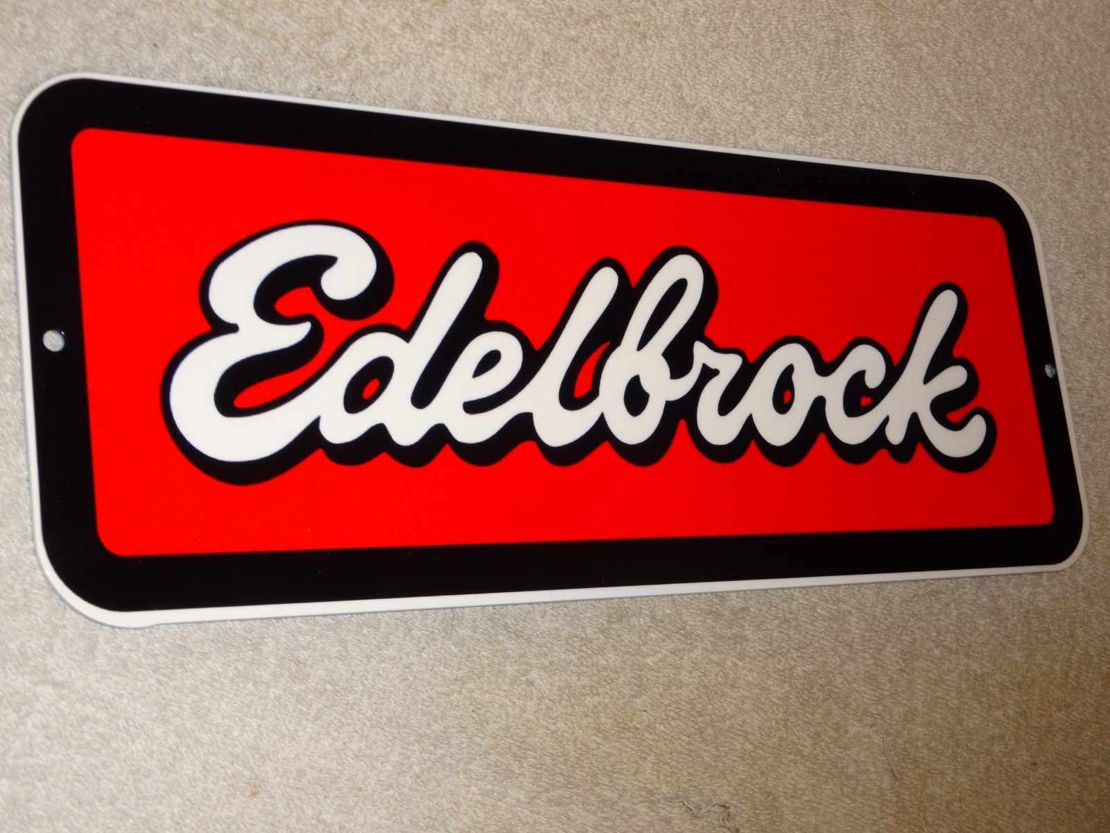 VINTAGE EDELBROCK PERFORMANCE AUTOMOTIVE PARTS METAL ENAMEL TRUCK GASOLINE SIGN