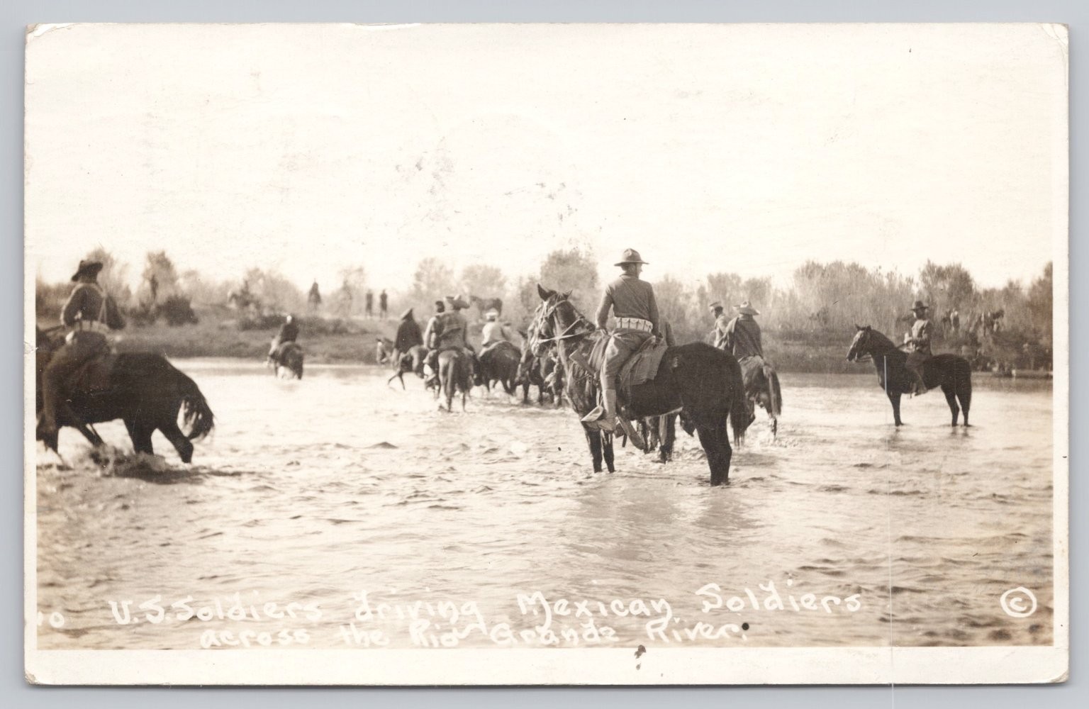 1916 RPPC US Soldiers Driving Mexican Soldiers Horseback Rio Grande River Border