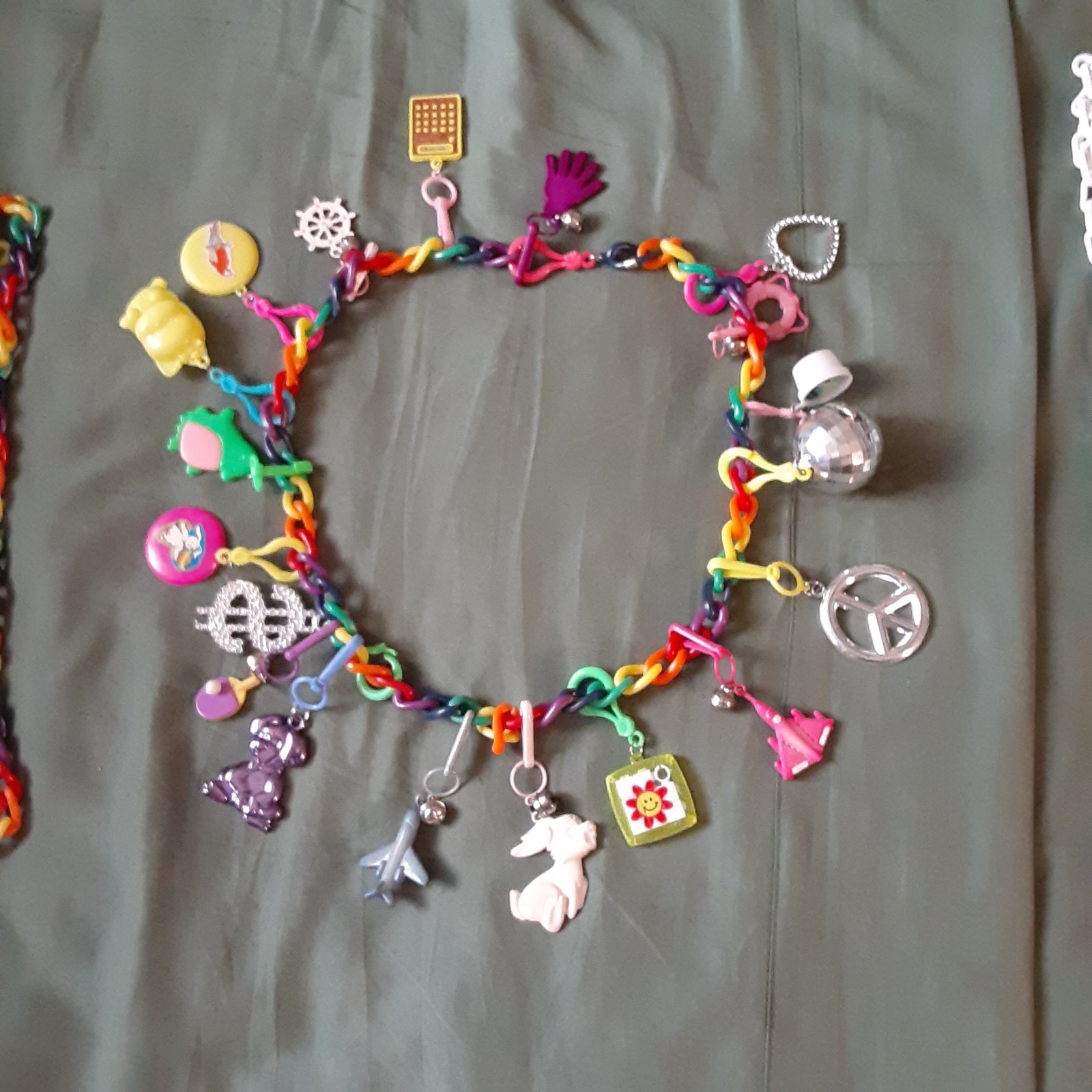 BELL CHARM NECKLACE w/ 19 CHARMS  all different also extra chains NEVER USED