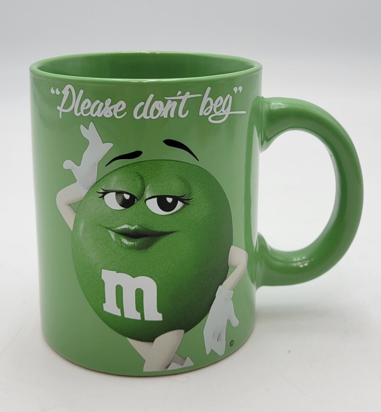 M&M Green Coffee Mug Please Don\'t Beg 2016