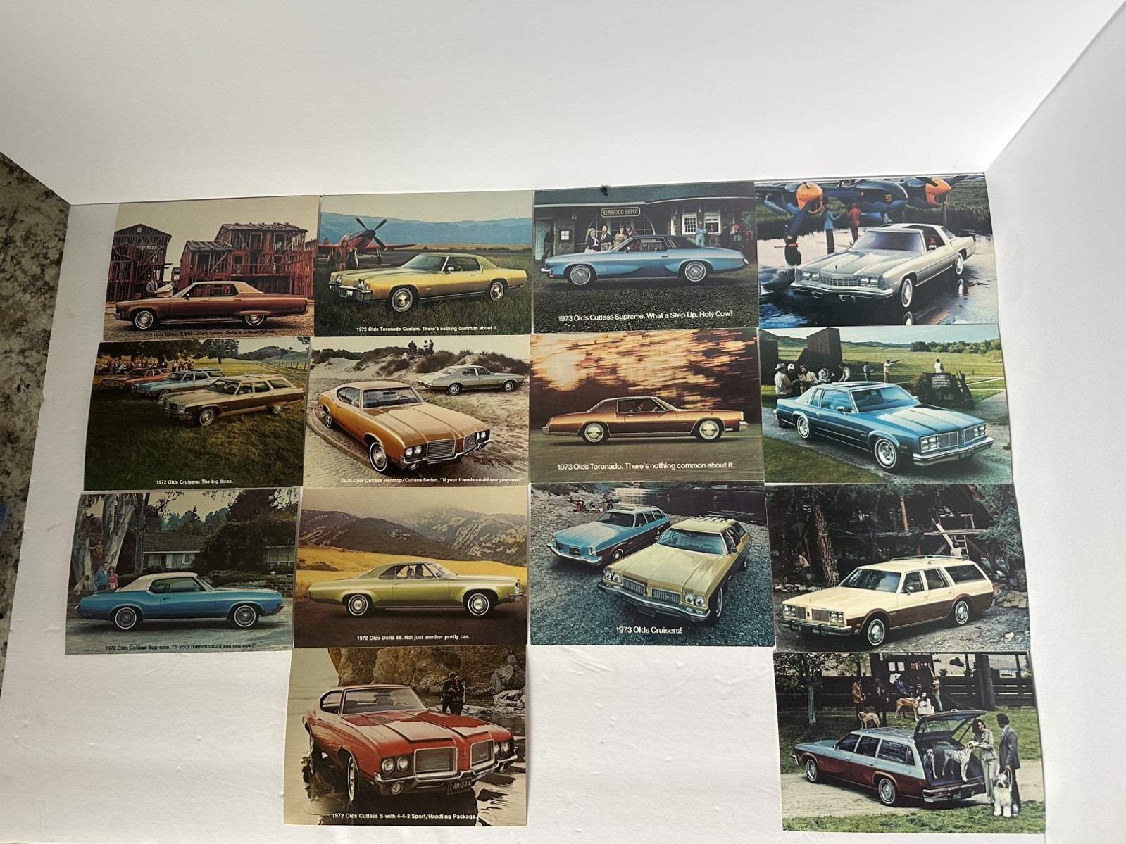 SET OF 14 - 1972 1973 1977 OLDSMOBILE DEALERSHIP  POSTCARDS  7 X 4 3/4 INCHES