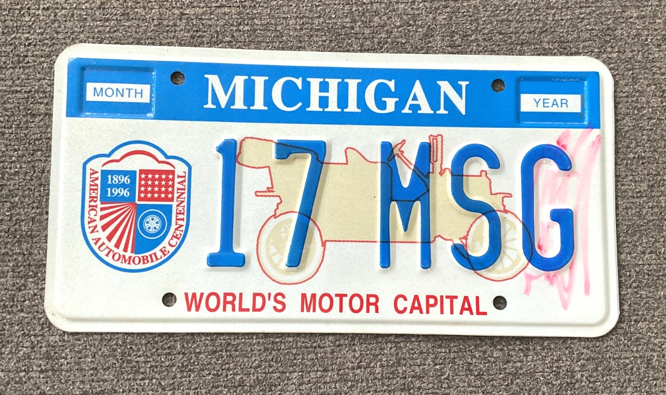 RARE 1990's WORLD MOTOR CAPITAL MICHIGAN GOVERNMENT MSG LICENSE PLATE RARE RARE RARE 1990's WORLD MOTOR CAPITAL MICHIGAN GOVERNMENT MSG LICENSE PLATE RARE RARE