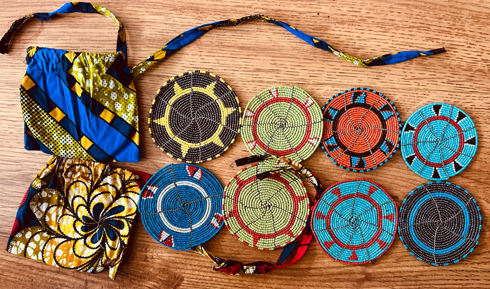2 sets 4 Kenya Maasai Mara authentic HANDMADE beaded coasters with 2 pouches NEW 2 sets 4 Kenya Maasai Mara authentic HANDMADE beaded coasters with 2 pouches NEW