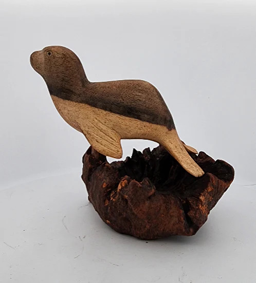 Hand-Carved Soro Wood Seal Figurine on Natural Base