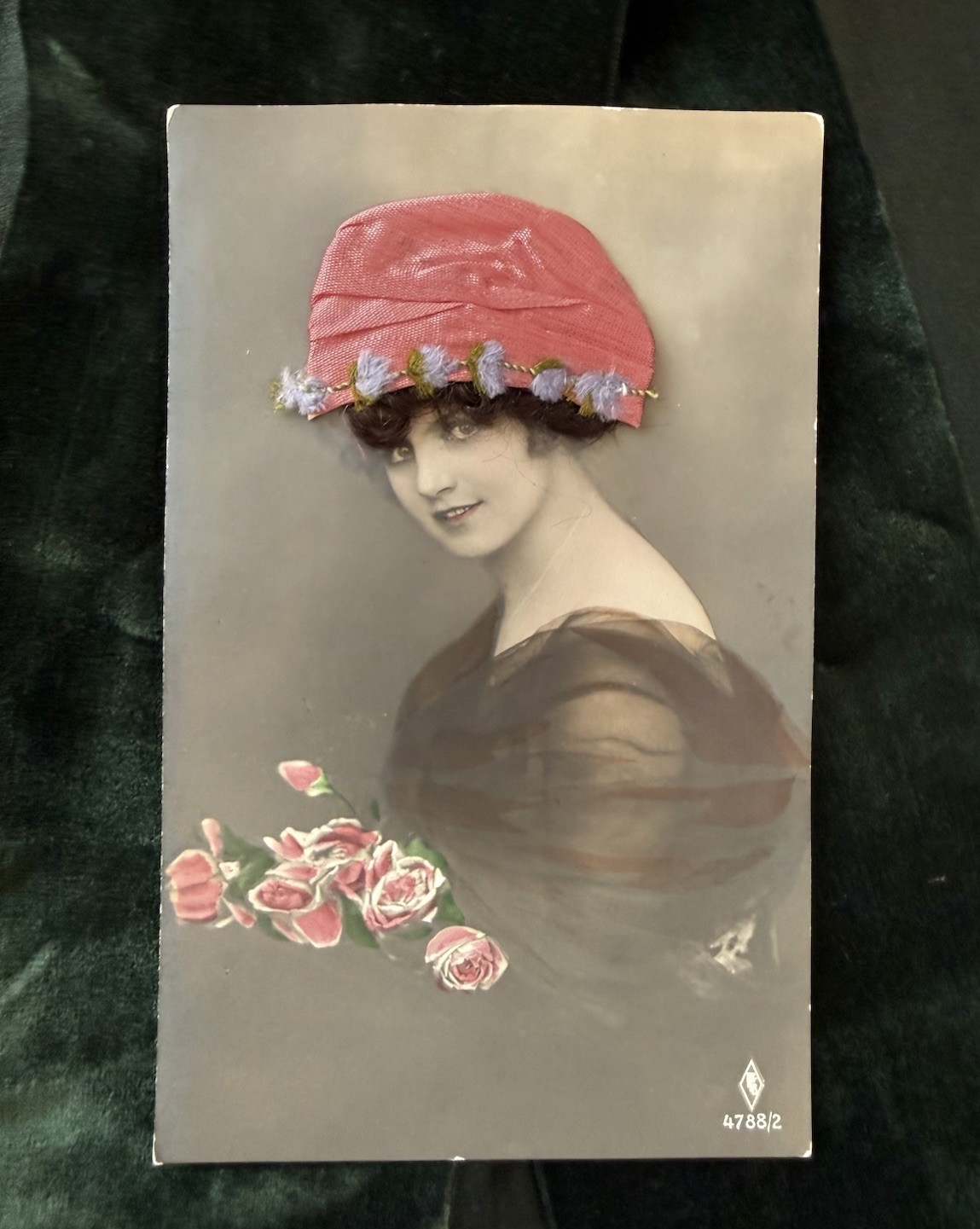 Antique 1910s RPPC lady with floral hat hair novelty postcard printed in Germany