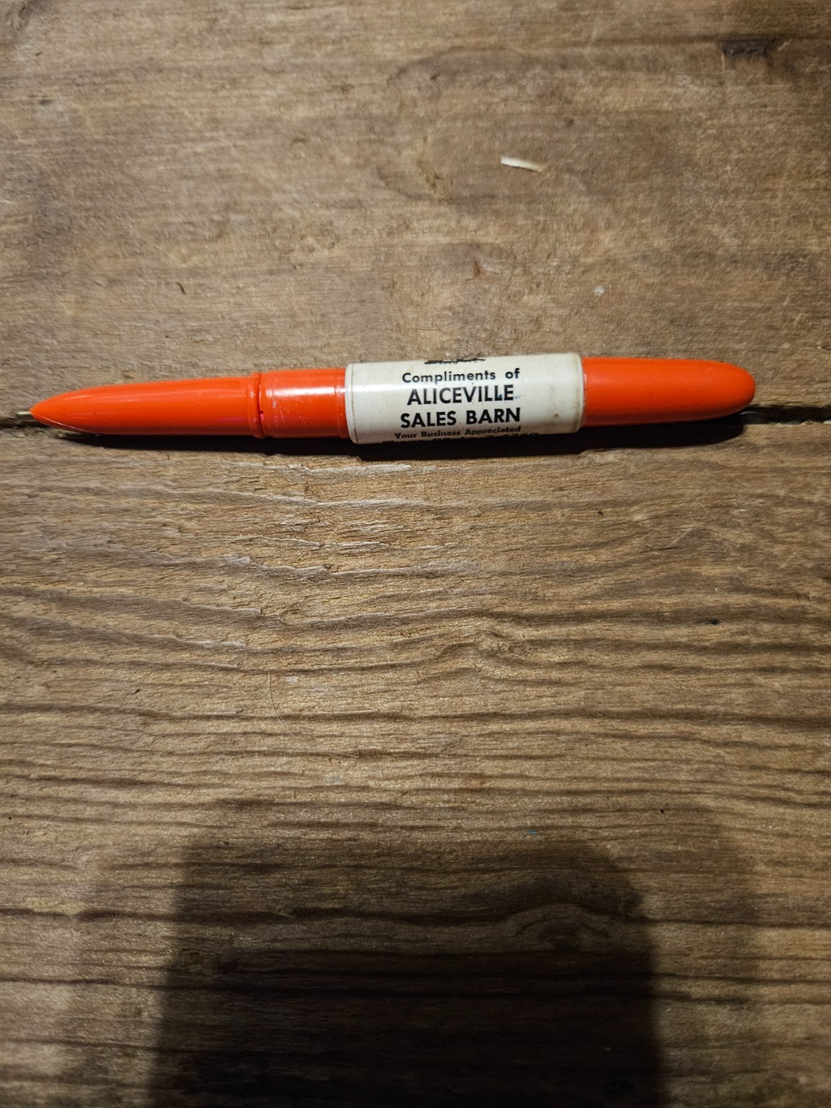 Compliments of Aliceville Alabama Sale Barn Pen with cow on it