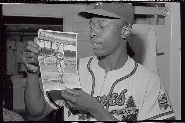 Hank Aaron looking at a picture of Bill Terry in 1930 Historic Old Photo