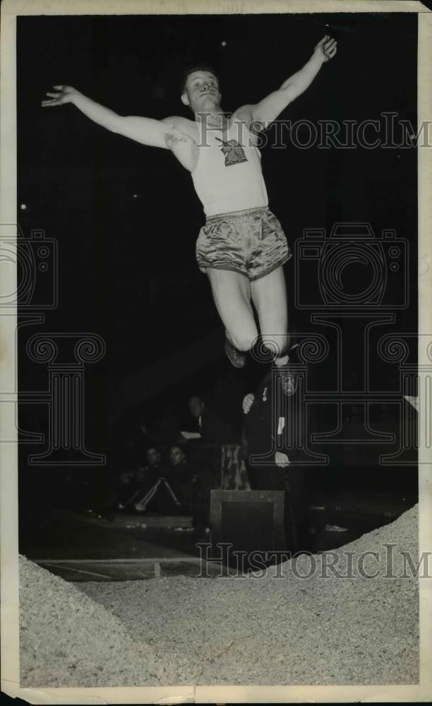 1941 Press Photo Track star Boster shown mid-jump at an event - net21594