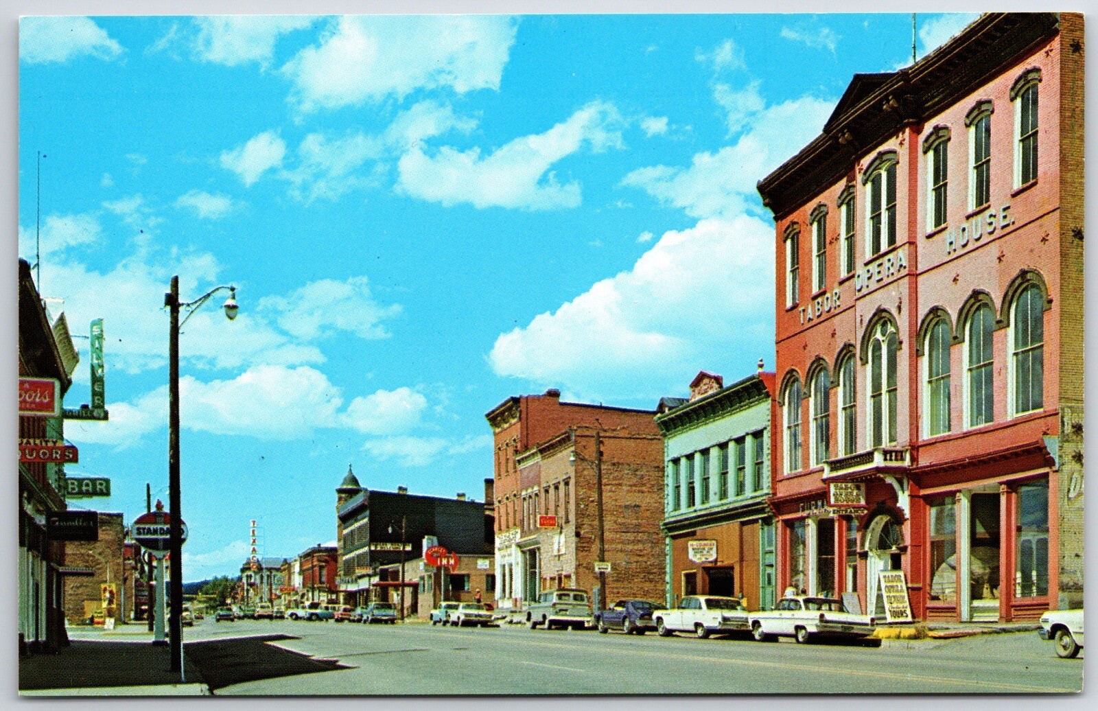 Leadville CO  HARRISON STREET SCENE OLD CARS STANDARD OIL GAS SIGN   POSTCARD