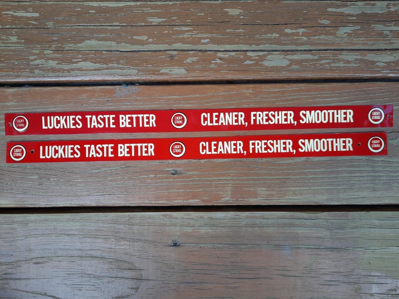 TWO VINTAGE NOS METAL PAINTED SHELF STRIP SIGN LUCKIES LUCKY STRIKE CIGARETTES