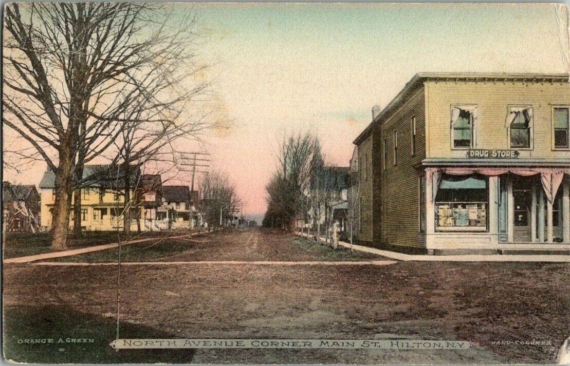1908. NORTH AVENUE,CORNER MAIN ST. HILTON, NY. DRUG STORE. POSTCARD. ZT24