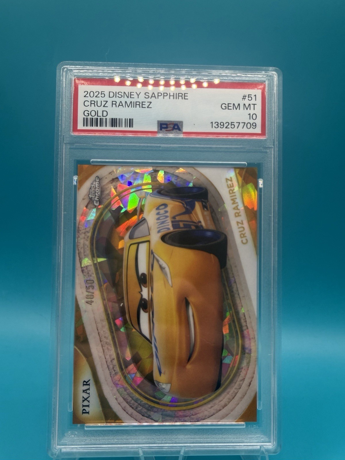 Topps 2025 Disney Sapphire Cruz Ramirez Gold Parallel #51 PSA 10 Card Topps 2025 Disney Sapphire Cruz Ramirez Gold Parallel #51 PSA 10 Card