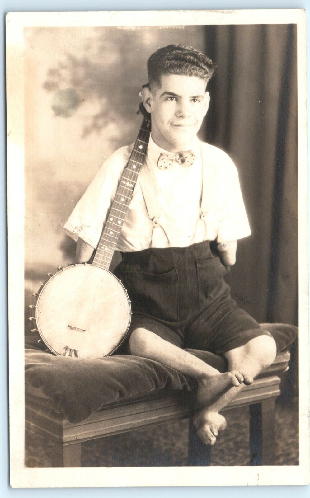 POSTCARD RPPC c1930s Man with Banjo Deformed Legs and Arms Studio Photo Johney