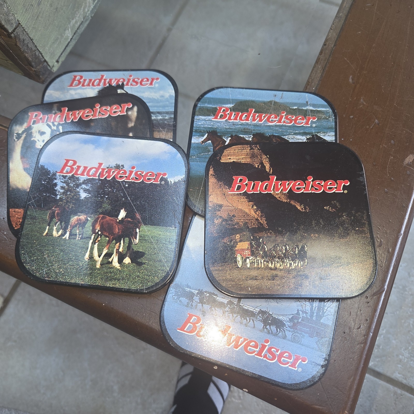 Budweiser-themed coasters featuring iconic Anheuser-Busch imagery