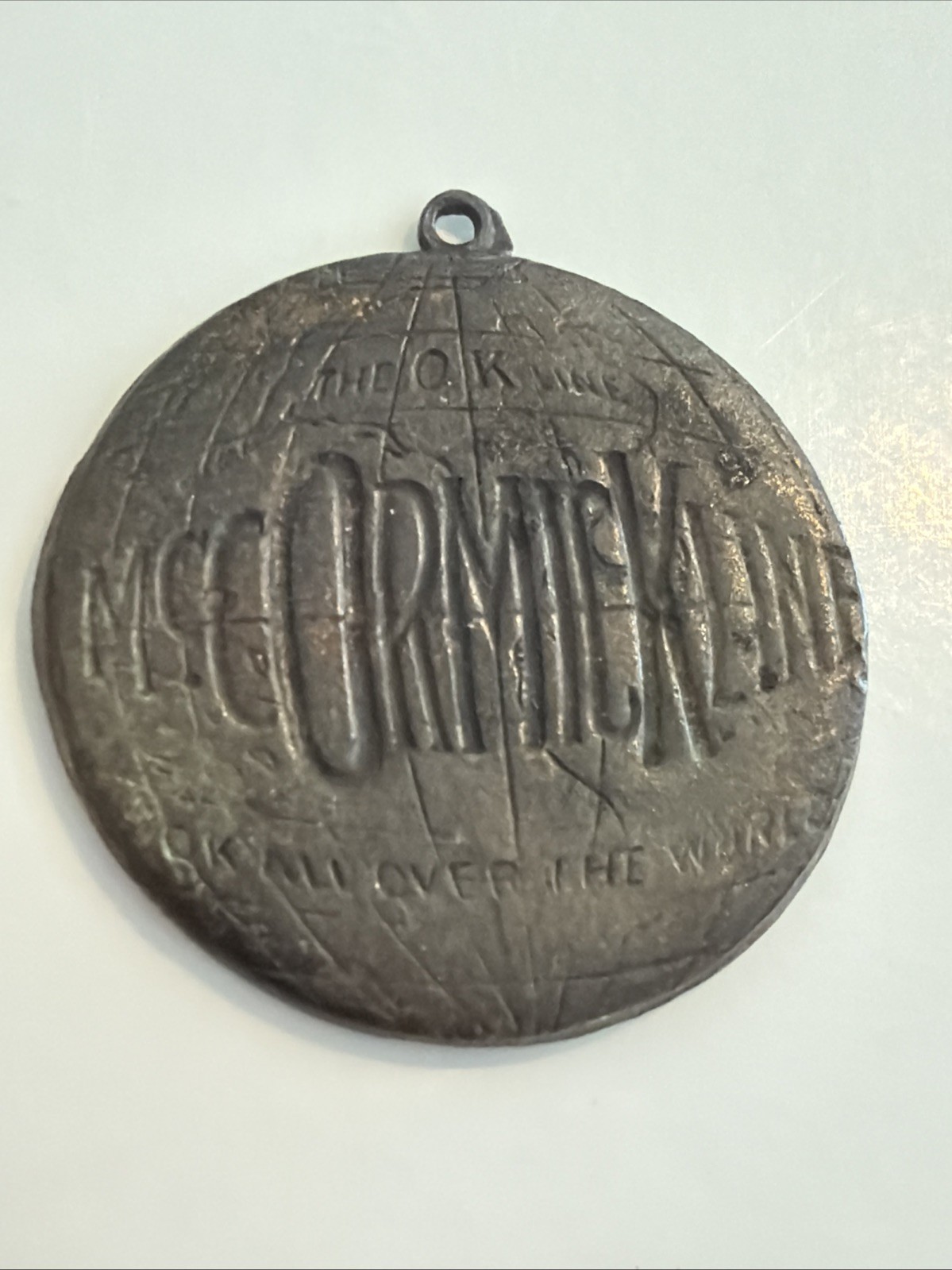 Antique McCormick OK Line Globe Advertising Watch Key Fob Medal Farm Equipment